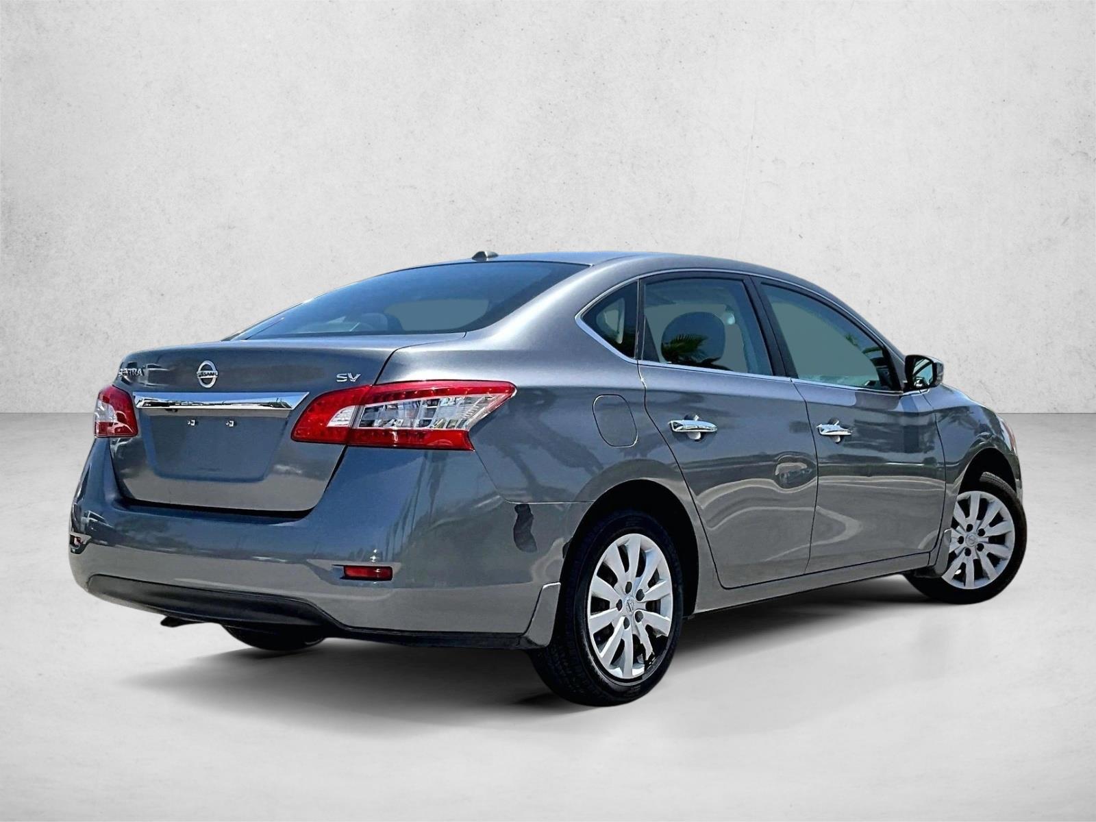 Used 2015 Gun Metallic Nissan SV image 2