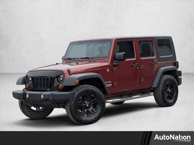 Red Rock Crystal Pearl 2010 Jeep Wrangler Unlimited Sport 4WD SUV / Crossover Four-Wheel Drive 4-Speed Automatic
